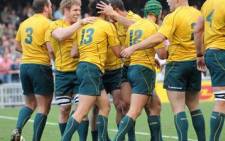 The Australian Wallabies celebrate after a try from Adam Ashley-Cooper (3rd L), against the New Zealand during the Bledisloe Cup in 2010. Picture: AFP/Ed Jones