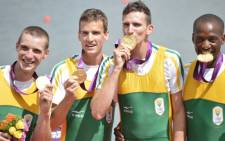 FILE: South Africa's James Thompson, Matthew Brittain, John Smith and Sizwe Ndlovu pose on the podium after receiving the gold medal in the men's lightweight four final A of the rowing event during the London 2012 Olympic Games on 2 August, 2012. Picture:AFP