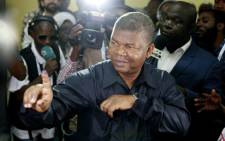 MPLA (The People's Movement for the Liberation of Angola) President Joao Lourenco shows his inked finger after voting in Luanda, on 23 August 2017 during the general elections. Picture: AFP.