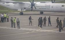 Mozambican soldiers are seen leaving the tarmac of the airport in Pemba on 31 March 2021. Sporadic clashes broke out in Palma on Tuesday as thousands of residents hid around the besieged northern Mozambique town, scrambling to escape the area overrun by jihadist militants, aid agencies said. Picture: AFP