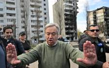 UN Secretary-General Antonio Guterres (C) gestures during his visit in Borodianka, outside Kyiv, on 28 April 2022. 