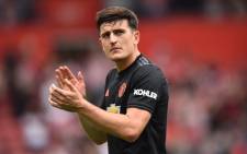 FILE: Manchester United's Harry Maguire applauds at the end of the English Premier League football match against Southampton at St Mary's Stadium in Southampton, southern England on 31 August 2019. Picture: AFP