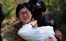 South Korean relatives of a victim of a capsized ferry react in Jindo on 20 April 2014. Picture: AFP.