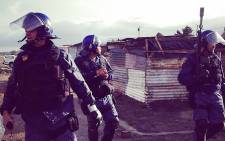 Tensions broke out in Nomzamo informal settlement near Strand outside Cape Town as residents fought to avoid eviction ON 3 June 2014. Picture: Carmel Loggenberg/EWN.