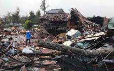 Damaged houses caused by weather patterns from Typhoon Hagibis are seen in Ichihara, Chiba prefecture on 12 October 2019. Powerful Typhoon Hagibis on 12 October claimed its first victim even before making landfall, as potentially record-breaking rains and high winds sparked evacuation orders for more than a million people. Picture: AFP