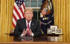 FILE: US President Donald Trump delivers a televised address to the nation on funding for a border wall from the Oval Office of the White House in Washington DC on 8 January 2019. Picture: AFP