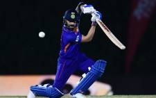 India's captain Virat Kohli plays a shot during the warmup cricket match between India and England for the ICC men’s Twenty20 World Cup at the ICC Cricket Academy Ground in Dubai on 18 October 2021. Picture: AFP