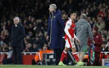 Arsenal’s manager Arsene Wenger greets Arsenal’s striker Alexis Sanchez after he is substituted during the Uefa Champions League last 16 second leg football match between Arsenal and Bayern Munich at The Emirates Stadium in London on 7 March, 2017. Picture: AFP.
