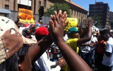Students, parents and workers from the University of Johannesburg gather outside the court singing and dancing as they wait for missing dockets to be found, which will allow for court proceedings to eventually start on 9 November 2015. Picture: Kgothatso Mogale/EWN.