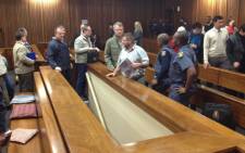 Some of the Boeremag accused being led to the holding cells in the North Gauteng High court. Picture: Barry Bateman/EWN