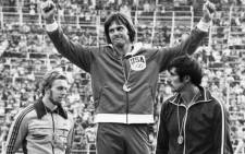 A file picture taken on 30 July, 1976 in Montreal, shows USAs Bruce Jenner (C) celebrating his gold medal on the podium after winning the mens decathlon competition, next to West German silver medalist Guido Kratschmer (L) and USSRs bronze medalist Nikolay Avilov. Picture: AFP.