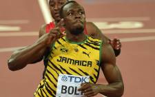 Jamaica’s Usain Bolt celebrates winning the final of the men’s 100 metres athletics event at the 2015 IAAF World Championships at the “Bird’s Nest” National Stadium in Beijing on 23 August, 2015. Picture: AFP.