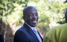 Democratic Alliance (DA) leader Mmusi Maimane laughs outside the Constitutional Court in Johannesburg after judgment in the Nkandla matter was handed down on 31 March 2016. Picture: Reinart Toerien/EWN.