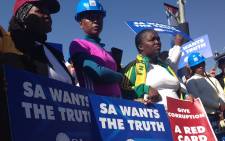 Democratic Alliance members hold placards during a picket at SAFA House on Friday 19 June 2015. Picture: Vumani Mkhize/EWN. 