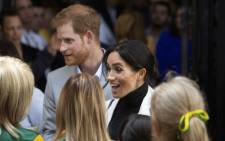 Britain's Prince Harry and his wife Meghan, Duchess of Sussex attend a lunchtime reception hosted by the Prime Minister with Invictus Games competitors and community representatives in the city’s central parkland, The Domain, in Sydney on 21 October, 2018. Picture: AFP.
