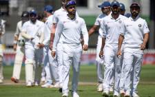 India's captain Virat Kohli (C) walks from the field with his team after losing the match to New Zealand during day four of the first Test cricket match between New Zealand and India at the Basin Reserve in Wellington on 24 February 2020. Picture: AFP