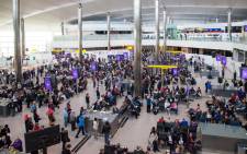 Hundreds of passengers at Heathrow International Airport in London waiting in long queues to board their flights. Picture: Facebook.