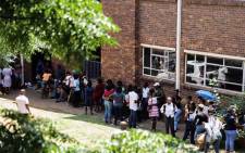Parents and guardians queuing outside the Johannesburg Central Education District on 15 January 2020 where they are calling for the online application process to be scrapped in Gauteng. Picture: Kayleen Morgan/EWN