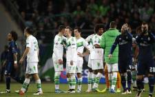 FILE. Players react after the UEFA Champions League quarter-final, first-leg football match between VfL Wolfsburg and Real Madrid on 6 April, 2016 in Wolfsburg, northern Germany. Wolfsburg won the match 2-0. Picture: AFP.