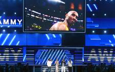 An image of the late Kobe Bryant is projected onto a screen while host Alicia Keys (2nd from L) and (from L) Nathan Morris, Wanya Morris, and Shawn Stockman of music group Boyz II Men perform onstage during the 62nd Annual GRAMMY Awards at STAPLES Center on 26 January 2020 in Los Angeles, California. Picture: AFP