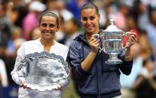 Flavia Pennetta (R) of Italy and Roberta Vinci (L) of Italy pose with their trophies after their Womens Singles Final match on Day Thirteen of the 2015 US Open at the USTA Billie Jean King National Tennis Center on 12 September, 2015 in the Flushing neighborhood of the Queens borough of New York City. Picture: AFP.