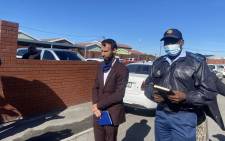 Western Cape Community Safety MEC Reagen Allen and provincial Police Commissioner Thembisile Patekile at the crime scene in the Taiwan informal settlement on Monday, 9 May 2022. Picture: Shamiela Fisher/Eyewitness News. 