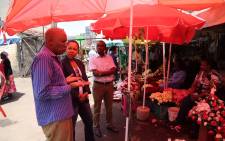 Nikiwe Bikitsha gets a guided tour of the Nairobi Flower Market. Picture: Primedia