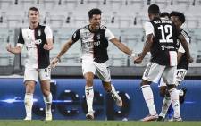 Juventus forward Cristiano Ronaldo (C) celebrates after scoring during the Italian Serie A football match between Juventus and Sampdoria played behind closed doors at the Allianz Stadium in Turin on 26 July 2020. Picture: AFP