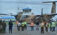FILE: A military plane transporting the bodies of victims massacred on 2 December, 2014 at Kenya’s remote north-eastern town of Mandera, bordering Somalia, arrives at the Wilson airport in Nairobi. Picture: AFP. 