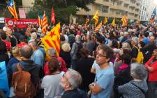 Some 500 people, some holding the Catalan flag, demonstrate outside the Spanish Consulate in Perpignan on 2 October 2017 to protest against police violence during a banned independence referendum in the Catalan region in Spain. Picture: AFP