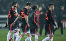 Manchester United players leave the pitch after the Uefa Europa League soccer match between FC Midtjylland and Manchester United in Herning, Denmark, 18 February 2016. Manchester lost the match 1-2. EPA/HENNING BAGGER