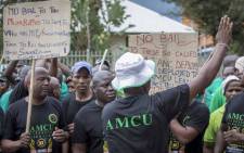 Amcu members outside the Brits Magistrates Court protest bail for the six murder accused appearing inside the court. Picture: Thomas Holder/EWN.