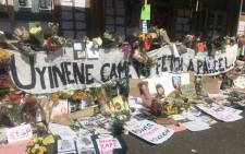 Flowers, posters and messages outside the post office in Claremont where Uyinene Mrwetyana was murdered. Picture: Lizell Persens/EWN
