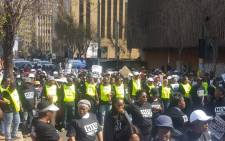 Members of the TAC and Corruption Watch marching outside the Gauteng legislature. Picture: Michael Pedro/EWN




 



