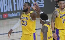 LeBron James (#23) of the Los Angeles Lakers high fives his teammate during the game against the Miami Heat during Game One of the NBA Finals on 30 September 2020 in Orlando, Florida at AdventHealth Arena. Picture: AFP