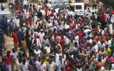 FILE: Supporters mass to see veteran rebel leader Agathon Rwasa in Bujumbura on 6 August 6, 2013. Rwasa returned to the capital of Burundi after three years in exile.  Picture: AFP.