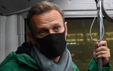 Russian opposition leader Alexei Navalny rides on a bus from a plane to a terminal of Moscow's Sheremetyevo airport on 17 January 2021. Picture: AFP