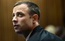 Oscar Pistorius on the second day of his murder trial on 4 March 2014 at the North Gauteng High Court in Pretoria. Picture: Pool.