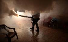 A Health Ministry employee fumigates a home against the Aedes aegypti mosquito to prevent the spread of the Zika virus. Picture: AFP/Marvin Recinos