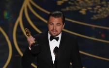 Actor Leonardo DiCaprio accepts the award for Best Actor in, ‘The Revenant’ on stage at the 88th Oscars on 28 February, 2016 in Hollywood, California. Picture: AFP.