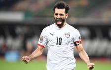 Egypt's forward Mohamed Salah celebrates after winning the Africa Cup of Nations (CAN) 2021 round of 16 football match between Ivory Coast and Egypt at Stade de Japoma in Douala on 26 January 2022. Picture: CHARLY TRIBALLEAU/AFP