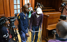 Xolile Mngeni enters the courtroom 2 in the Western Cape High Court with the aid of his walker on 5 December 2012. Picture: Aletta Gardner/EWN