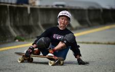 This photo taken on 9 September 2020 shows longboarder and cancer survivor Nongluck Chairuettichai, also known as Jeab, braking during a practice session in Bangkok. Picture: AFP