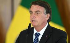 Brazilian President Jair Bolsonaro delivers a speech during the signing of agreements with his Colombian counterpart Ivan Duque at Planalto Palace in Brasilia, on 19 October 2021. Picture: EVARISTO SA/AFP