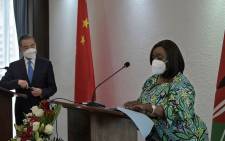 China's Foreign Minister Wang Yi (L) listens on as he and his Kenyan counterpart, Raychelle Omamo (R) during a joint press conference following a bilateral meeting at the Sarova Whitesands Hotel in the Kenyan coastal city of Mombasa on January 6, 2022. Picture: Tony KARUMBA / AFP 