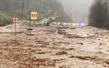This handout photo taken and released on 14 November 2021 by the British Columbia Ministry of Transportation and Safety shows a mudslide closing Highway 1 between Popkum and Hope, east of Chilliwack, Canada. Relentless rain battered Canada's Pacific coast on 15 November 2021, forcing evacuations and sending mudslides, rocks and debris across highways that left motorists trapped east of Vancouver. Picture: Handout/British Columbia Ministry of Transportation and Safety/AFP