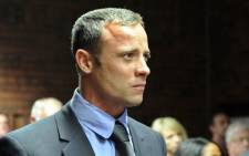 FILE: Oscar Pistorius in court on charges of murdering his model girlfriend, Reeva Steenkamp. Picture: AFP.