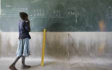 FILE: In this file photo taken on 23 November 2004, a pupil performs mathematical operations Nongana Fulfulde primary bilingual school in the village of Nongana of Ziniare in plateau central region, north of Ouagadougou. Picture: AFP
