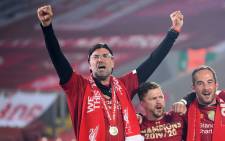 Liverpool manager Jurgen Klopp (left) celebrates during the Premier League trophy presentation following the English Premier League football match between Liverpool and Chelsea at Anfield in Liverpool, north west England on 22 July 2020. Picture: AFP