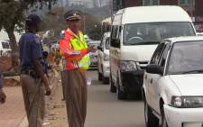 Johannesburg Metro Police Spokesperson Wayne Minnaar directs traffic during an Easter road safety operation in Alexandra, 31 March 2015. Picture: Vumani Mkhize. 
